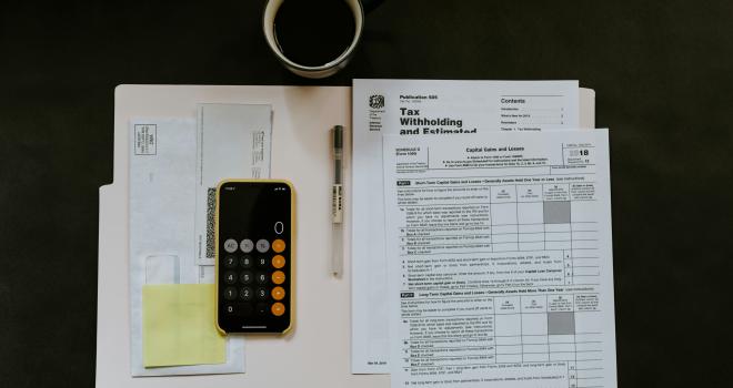 papers and coffee on a desk